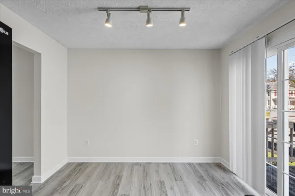 a view of a space with wooden floor
