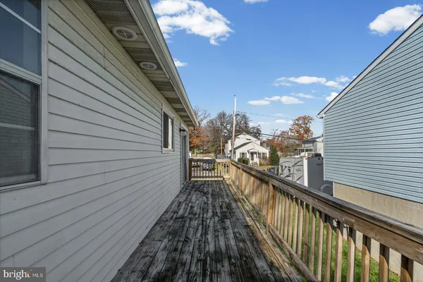 a view of a balcony with wooden floor