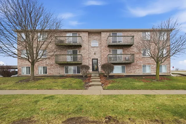 a living room with furniture ceiling fan and a large window