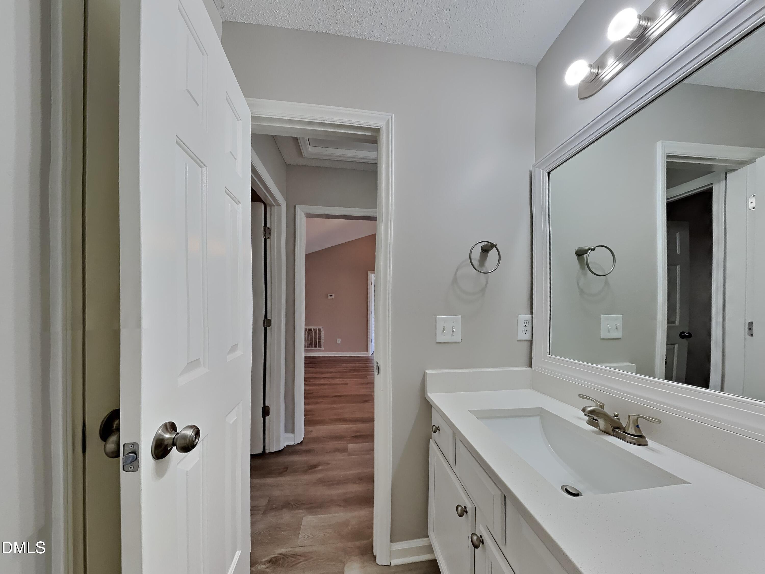 2028 Ballston Place Knightdale, NC 27545 - Photo 13 of 15 a bathroom with a double vanity sink and mirror