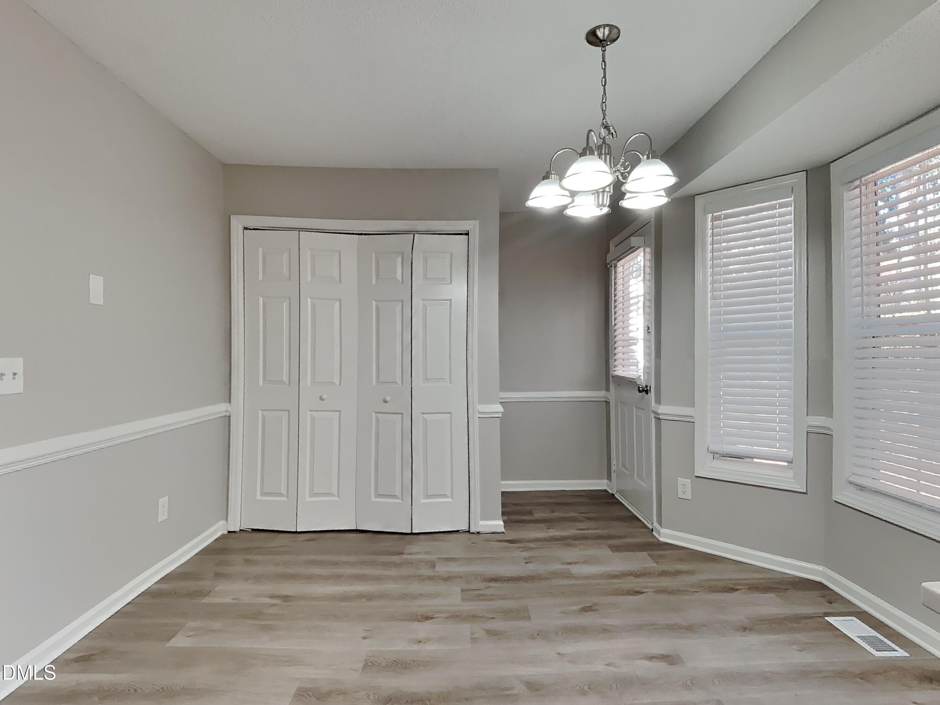 2028 Ballston Place Knightdale, NC 27545 - Photo 4 of 15 a view of a chandelier in a room