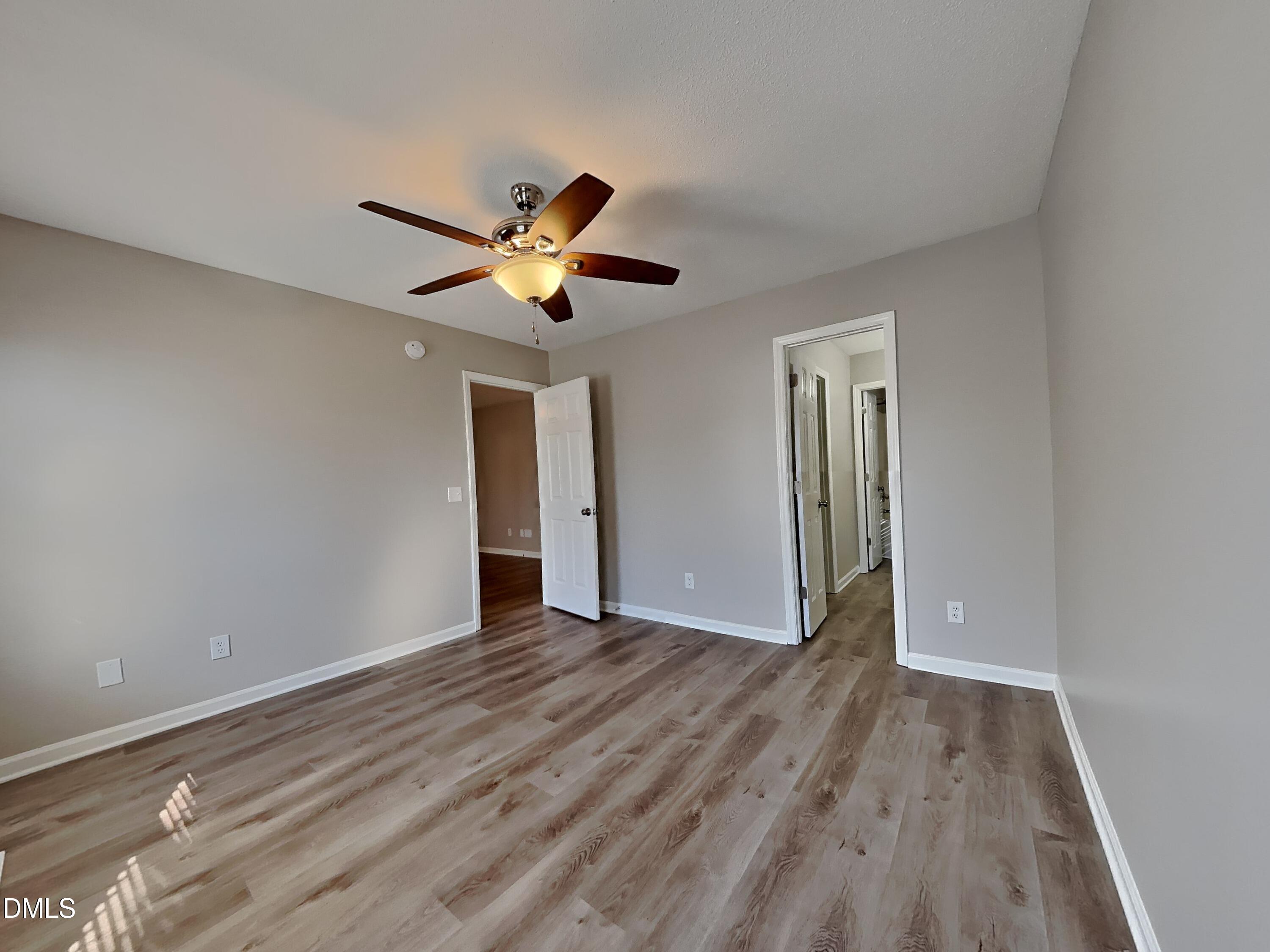 2028 Ballston Place Knightdale, NC 27545 - Photo 6 of 15 a view of an empty room with wooden floor