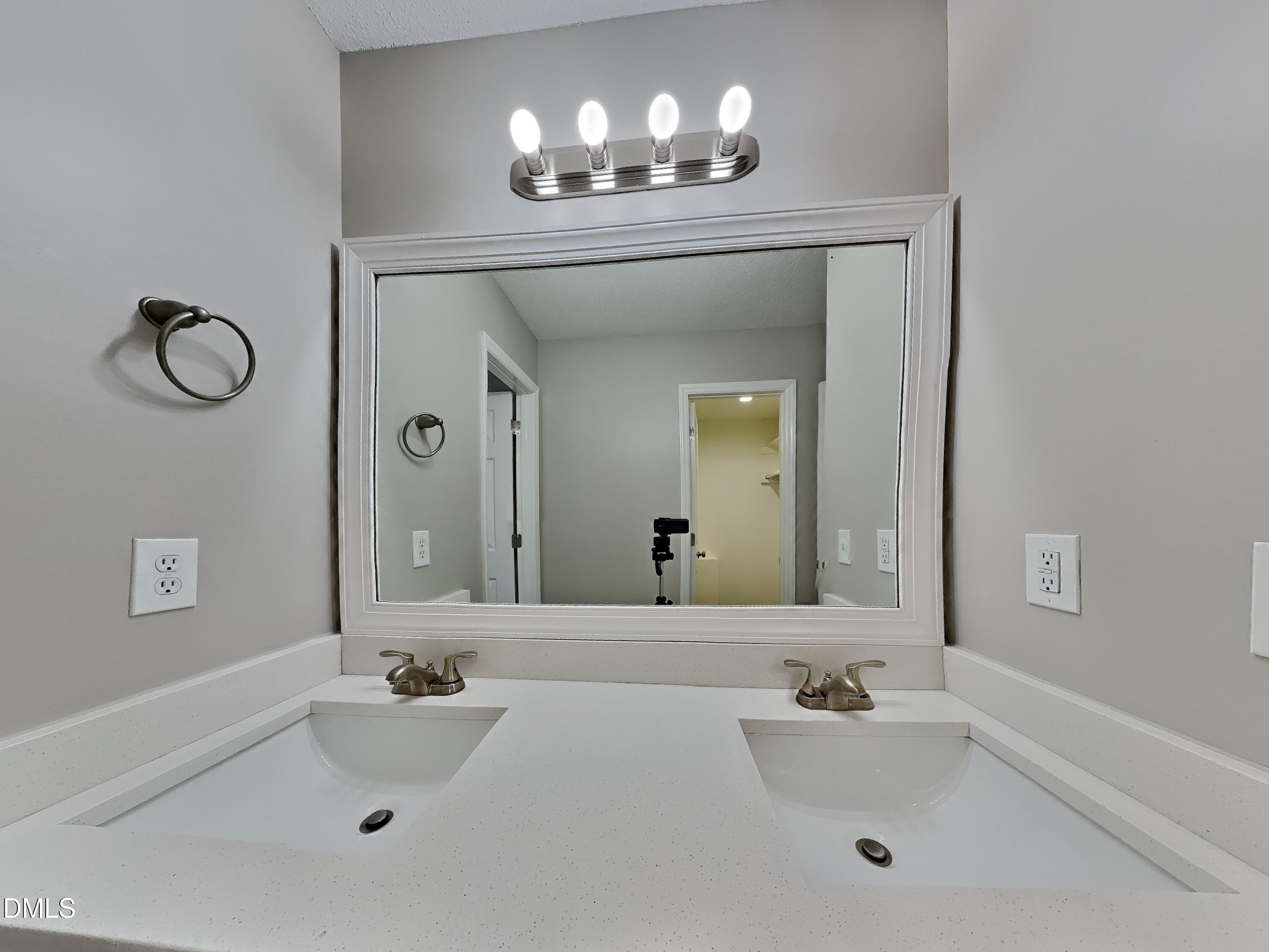 2028 Ballston Place Knightdale, NC 27545 - Photo 8 of 15 a bathroom with a sink and a mirror