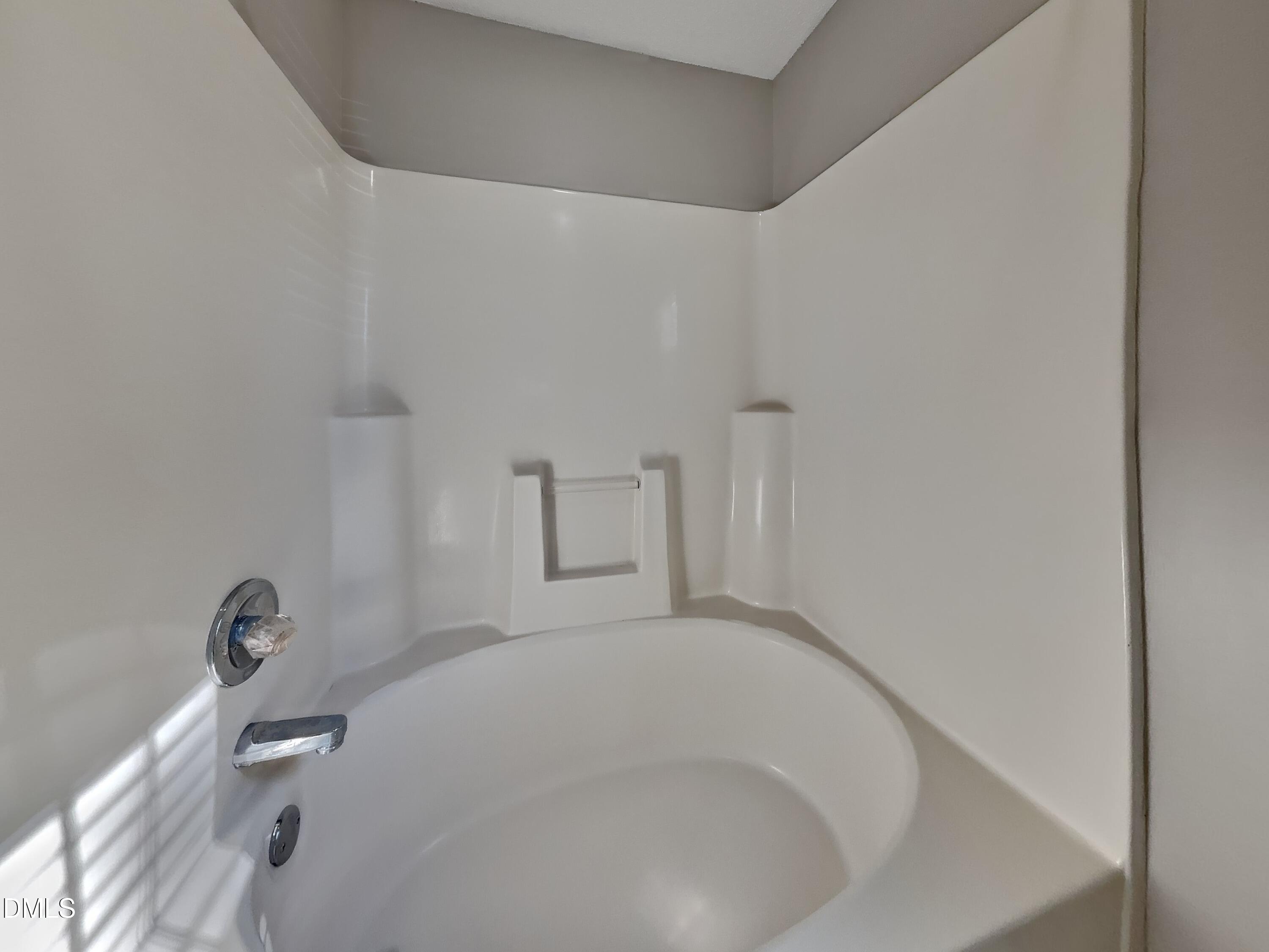 2028 Ballston Place Knightdale, NC 27545 - Photo 9 of 15 a bathroom with a bathtub