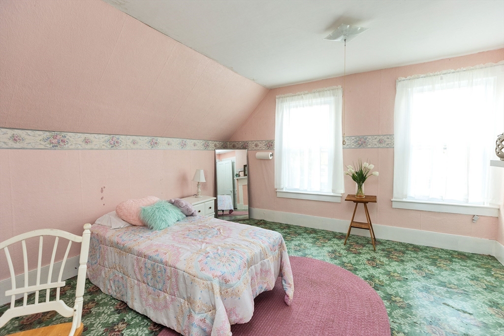 15 Main Street Allenstown, NH 03275 - Photo 18 of 39 a bedroom with a bed and a window