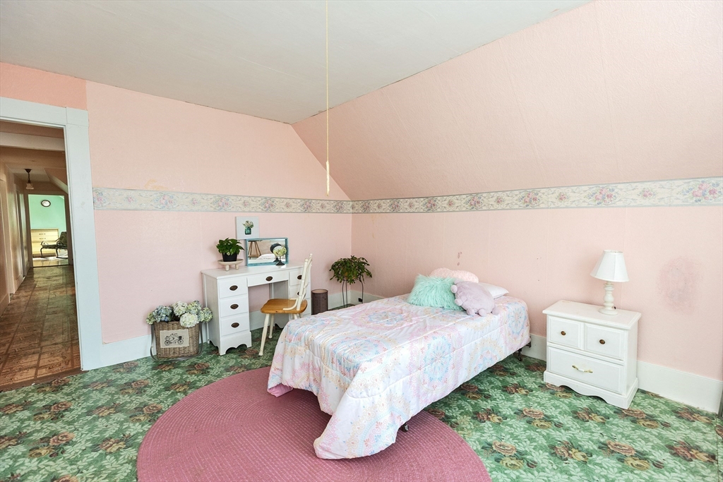 15 Main Street Allenstown, NH 03275 - Photo 19 of 39 a bedroom with a bed and a night stand