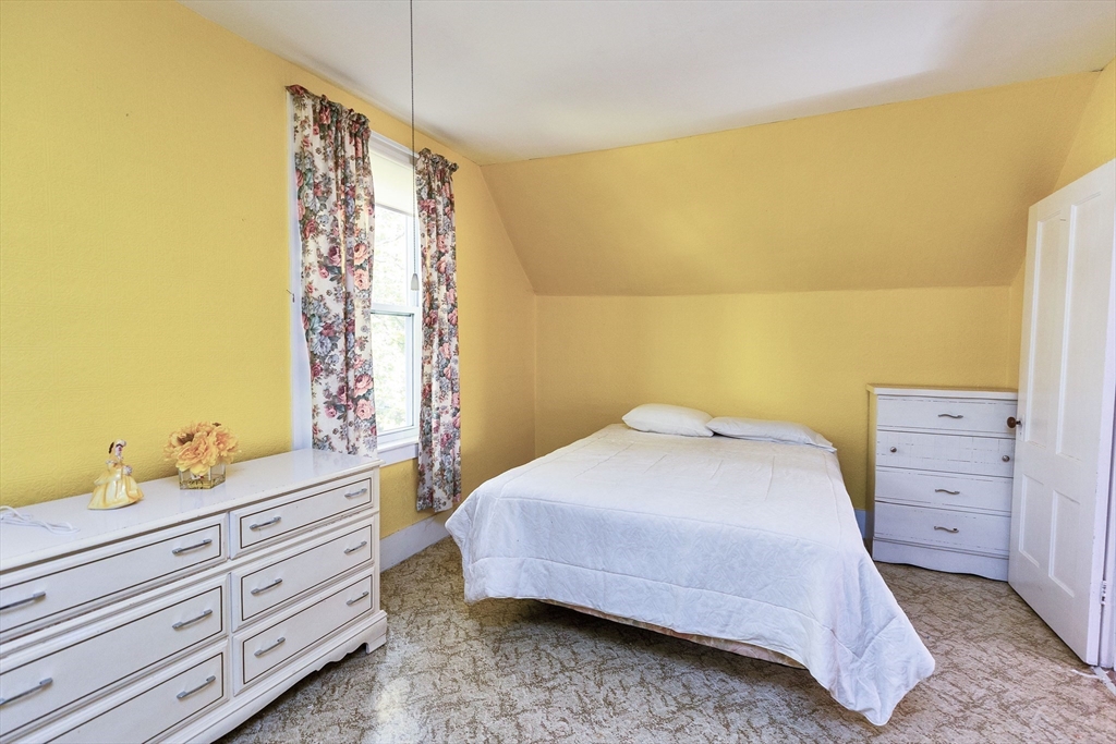 15 Main Street Allenstown, NH 03275 - Photo 22 of 39 a bedroom with a bed and a window