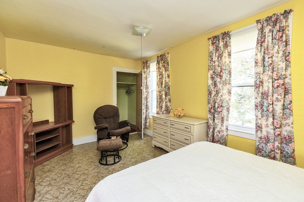 15 Main Street Allenstown, NH 03275 - Photo 23 of 39 a bedroom with a bed and wooden floor