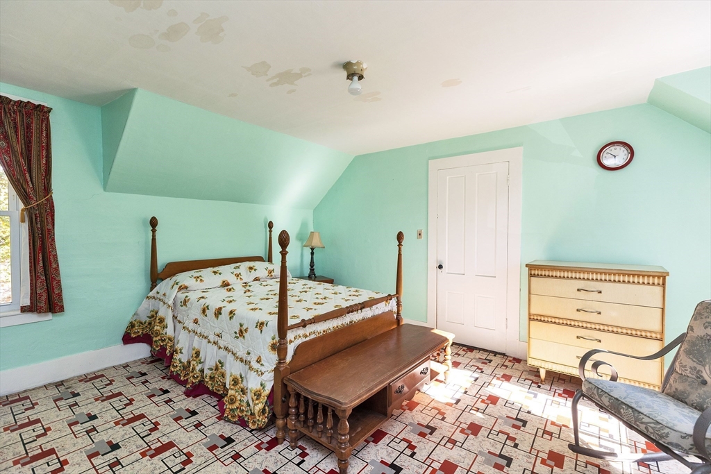 15 Main Street Allenstown, NH 03275 - Photo 25 of 39 a bed room with a bed window and a rug