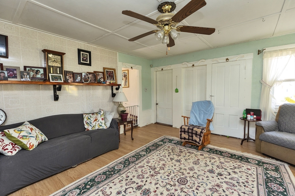 15 Main Street Allenstown, NH 03275 - Photo 4 of 39 a living room with furniture and a rug