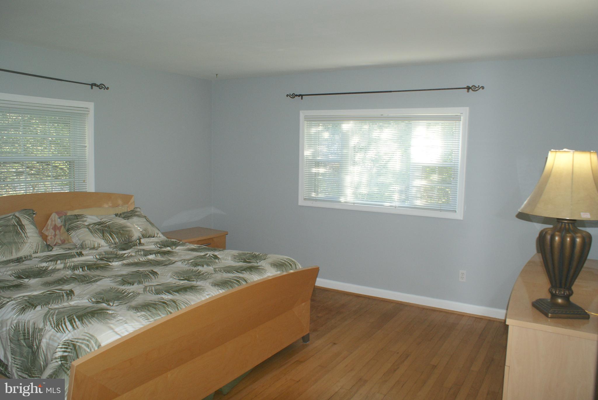 13413 Clifton Road Silver Spring, MD 20904 - Photo 14 of 30 a bedroom with a bed and a window