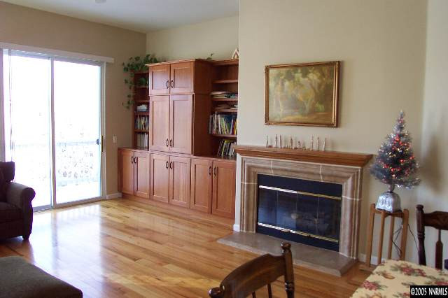 1815 Caughlin Creek Road Reno, NV 89519 - Photo 5 of 9 a living room with furniture a fireplace and a window