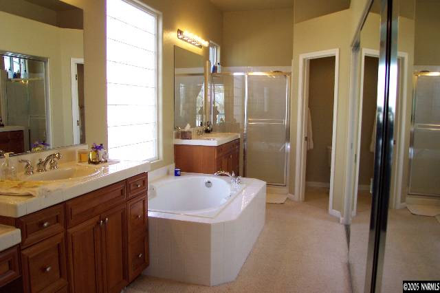 1815 Caughlin Creek Road Reno, NV 89519 - Photo 7 of 9 a bathroom with a tub sink and mirror