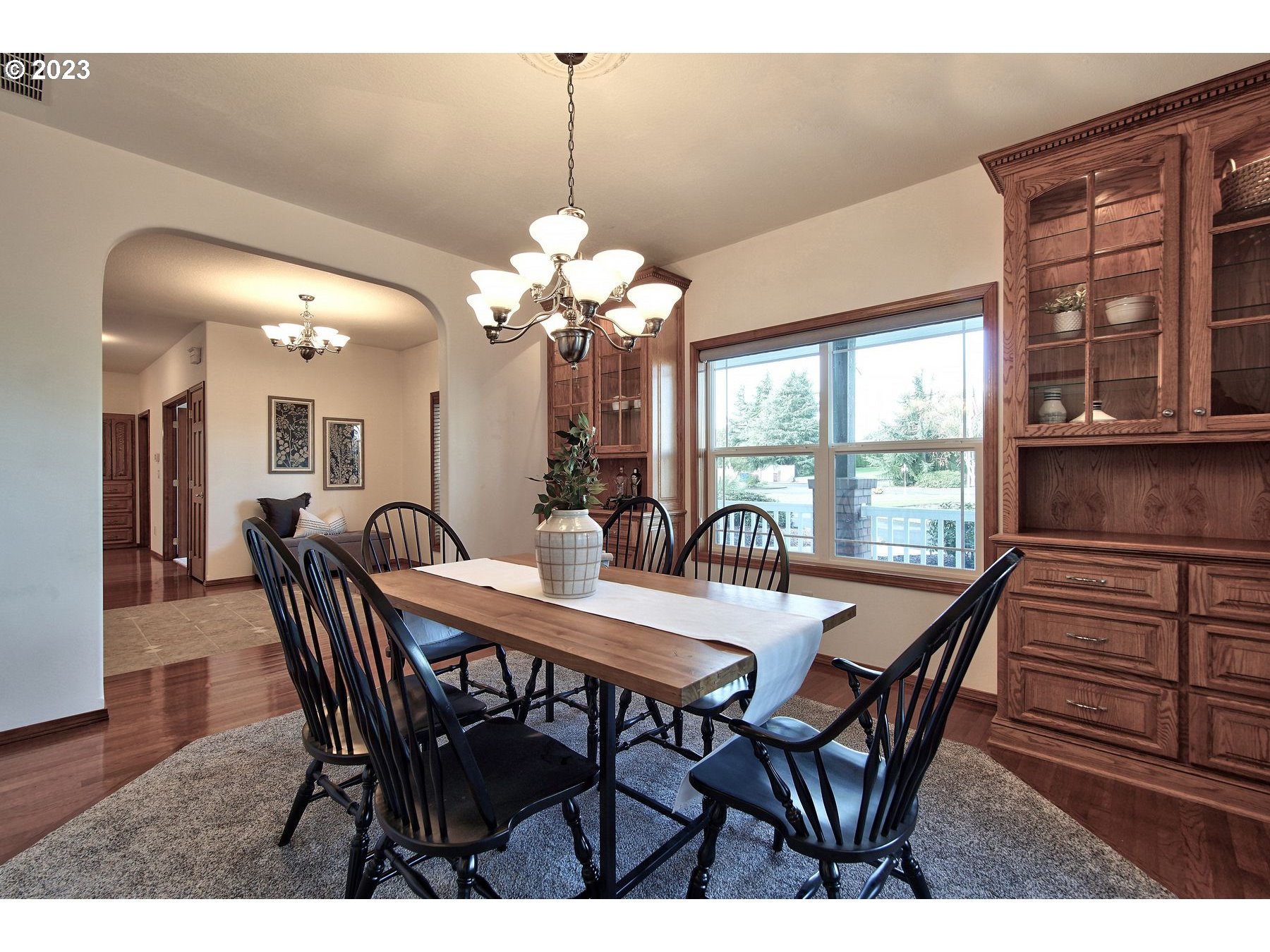 1101 Northeast 264th Street Ridgefield, WA 98642 - Photo 15 of 48 a view of a dining room with furniture window and wooden floor