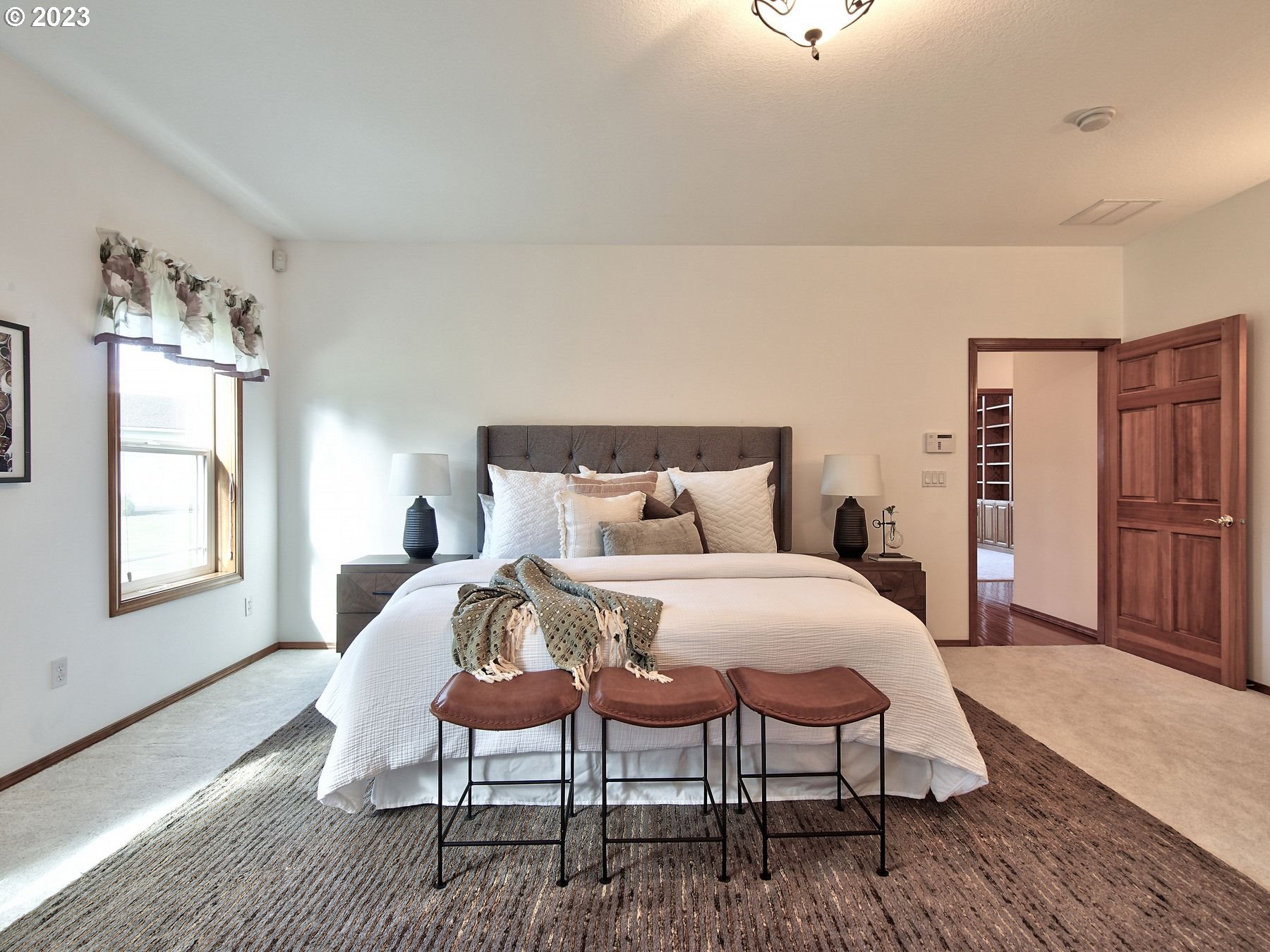 1101 Northeast 264th Street Ridgefield, WA 98642 - Photo 21 of 48 a bedroom with a bed and a table