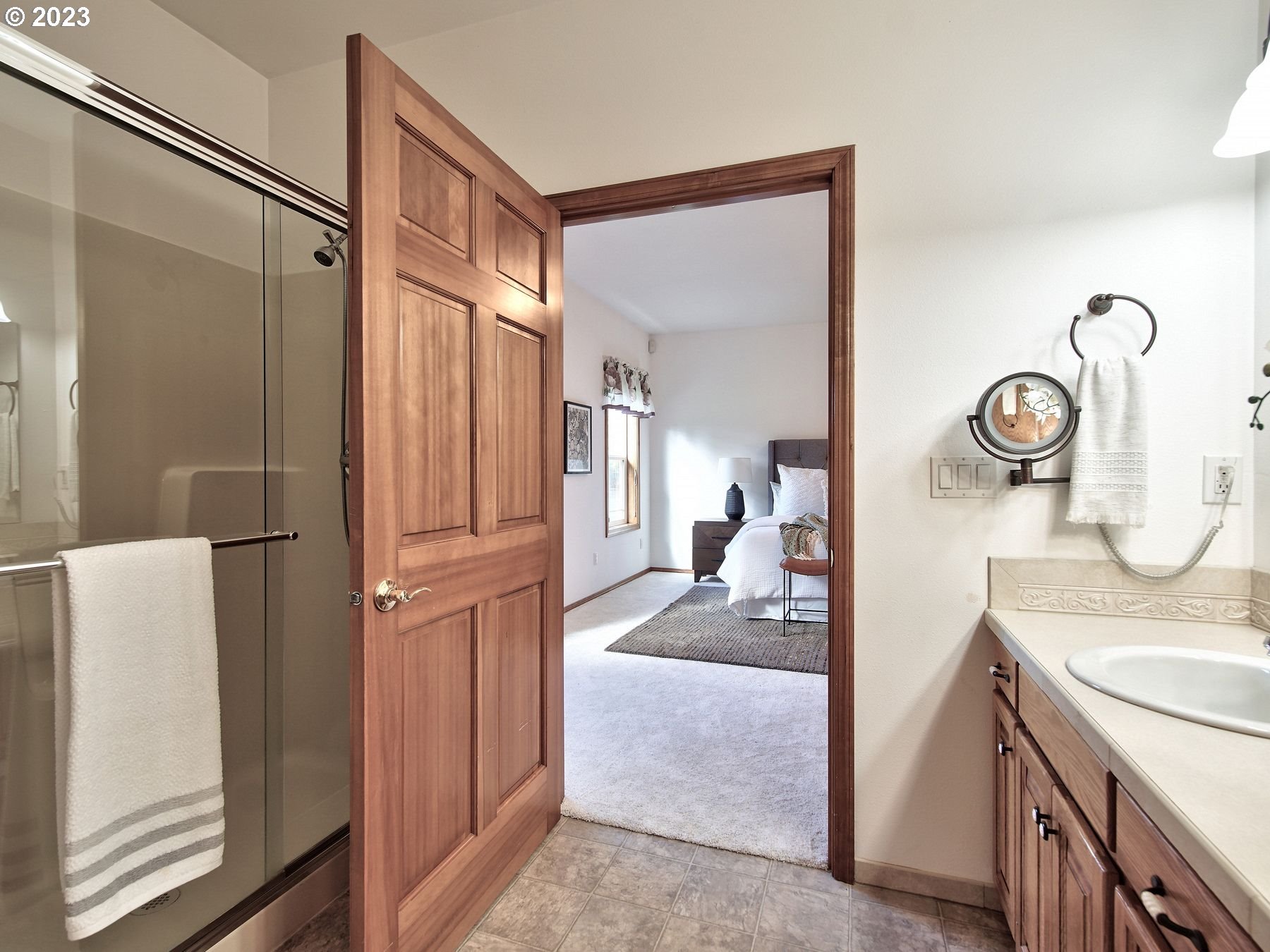 1101 Northeast 264th Street Ridgefield, WA 98642 - Photo 25 of 48 a en suite bathroom with a granite countertop sink mirror and shower