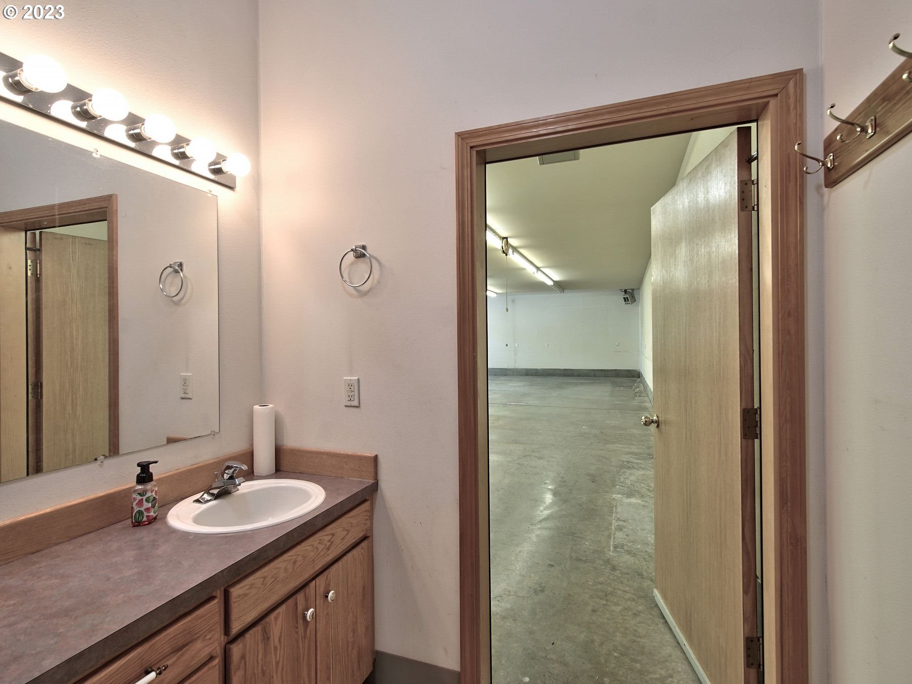 1101 Northeast 264th Street Ridgefield, WA 98642 - Photo 39 of 48 a bathroom with a granite countertop sink shower and a mirror