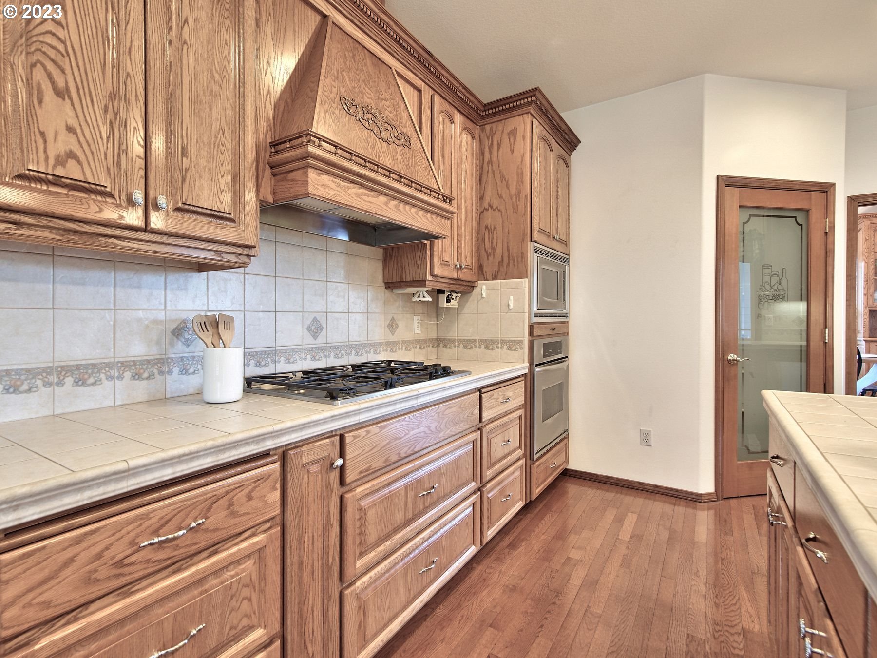 1101 Northeast 264th Street Ridgefield, WA 98642 - Photo 10 of 48 a kitchen with stainless steel appliances granite countertop a sink and a stove
