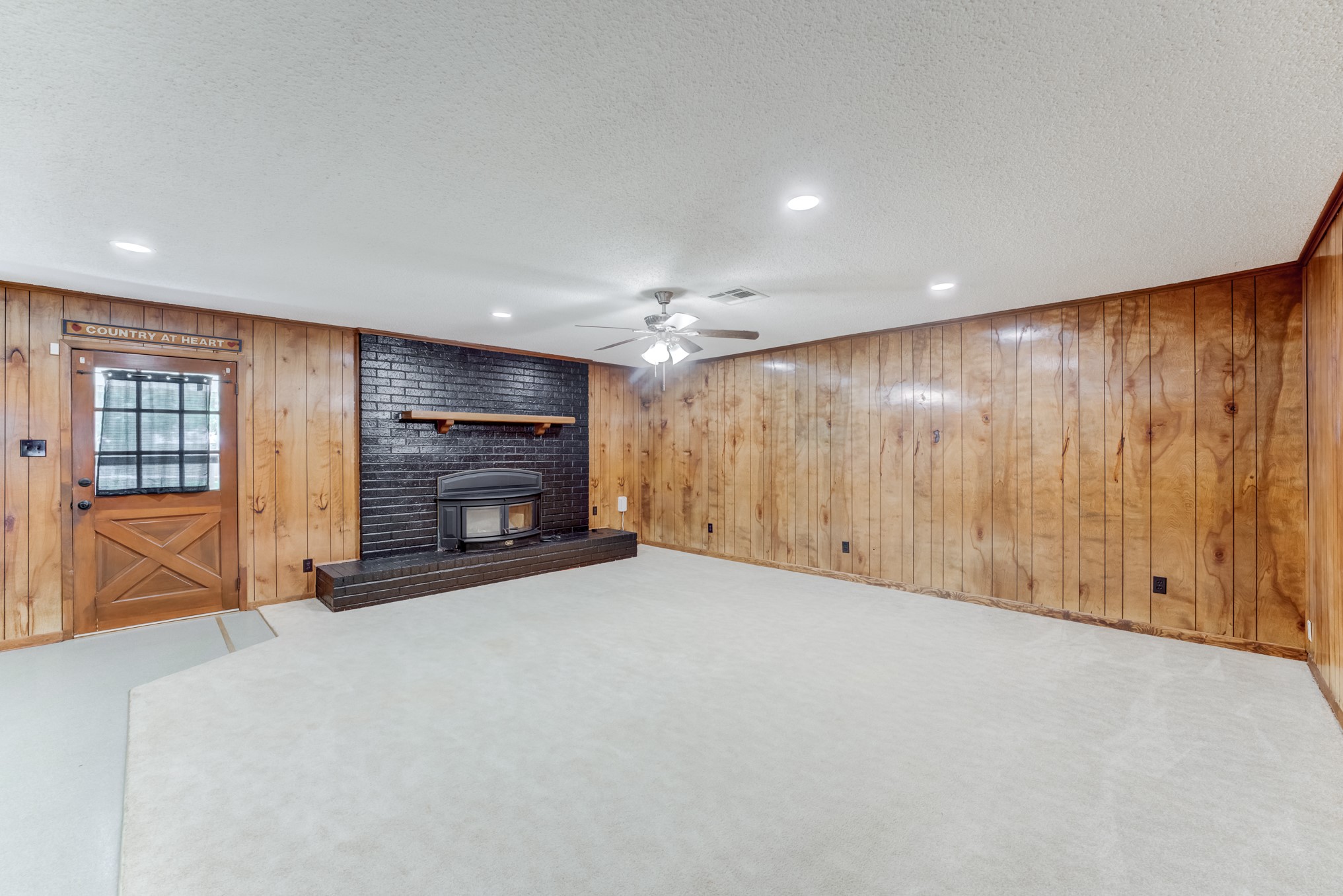 305 Yaupon Street Sweeny, TX 77480 - Photo 13 of 50 a view of an empty room with a fireplace