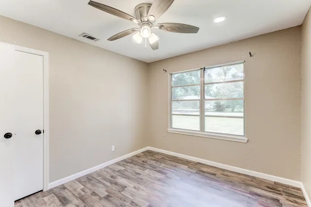 a view of an empty room with a window