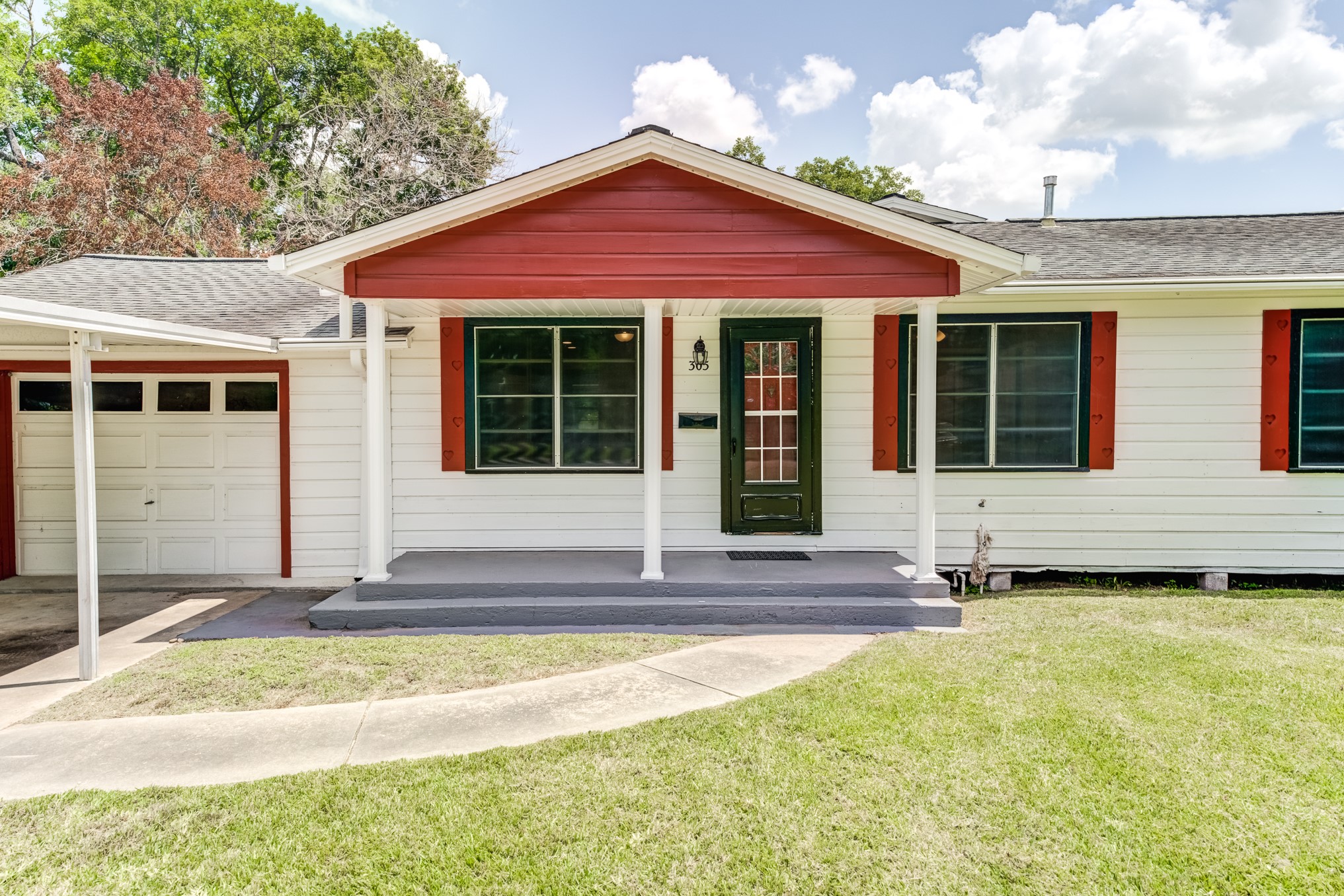 305 Yaupon Street Sweeny, TX 77480 - Photo 4 of 50 a view of a house with a small yard and plants