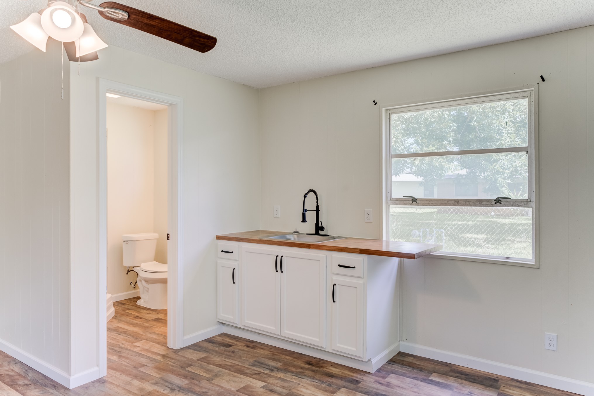 305 Yaupon Street Sweeny, TX 77480 - Photo 43 of 50 a view of a bathroom with a sink and a window