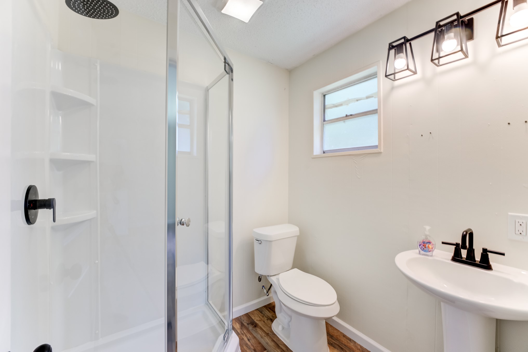 305 Yaupon Street Sweeny, TX 77480 - Photo 44 of 50 a bathroom with a toilet sink and mirror