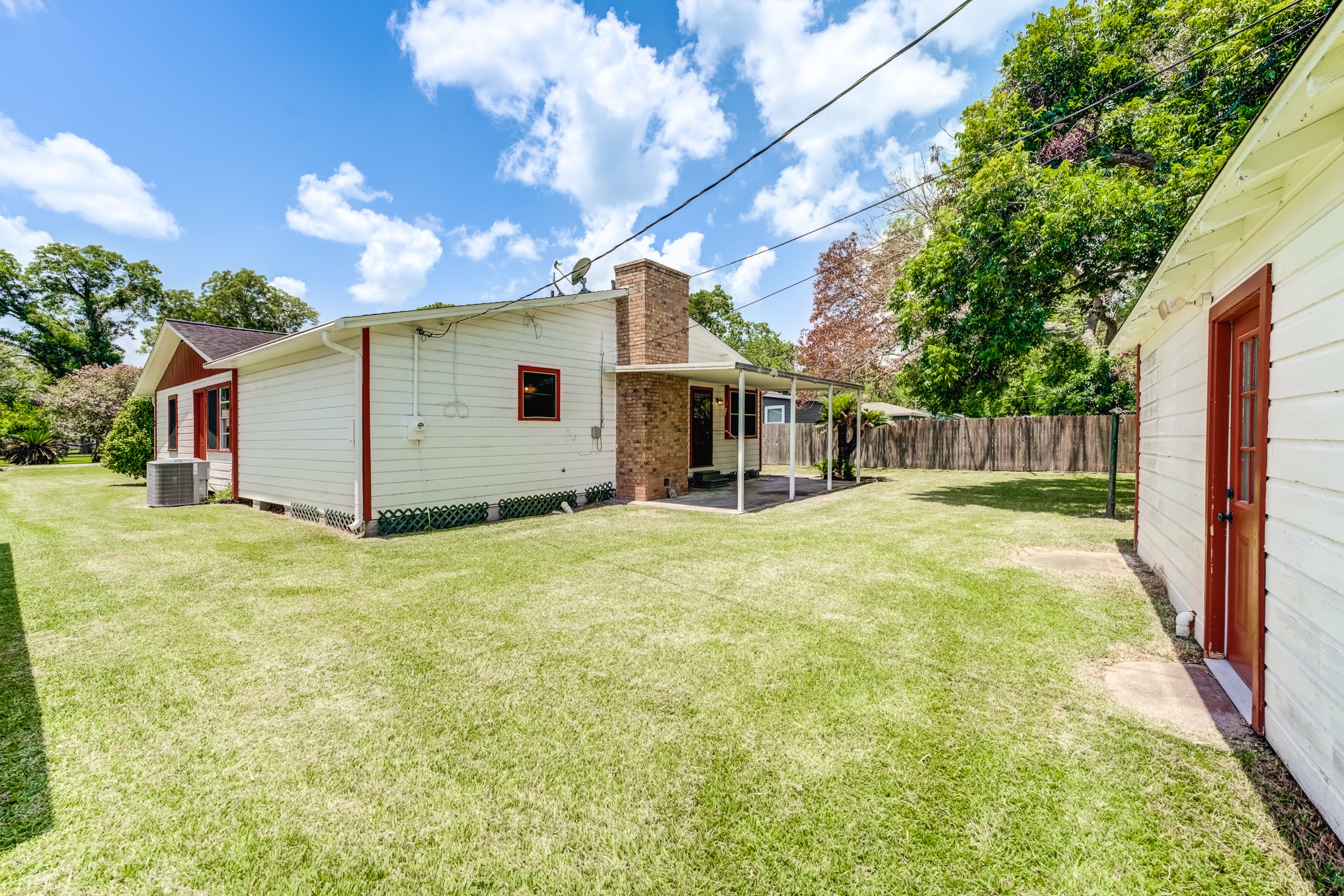 305 Yaupon Street Sweeny, TX 77480 - Photo 47 of 50 a view of a house with backyard and a tree