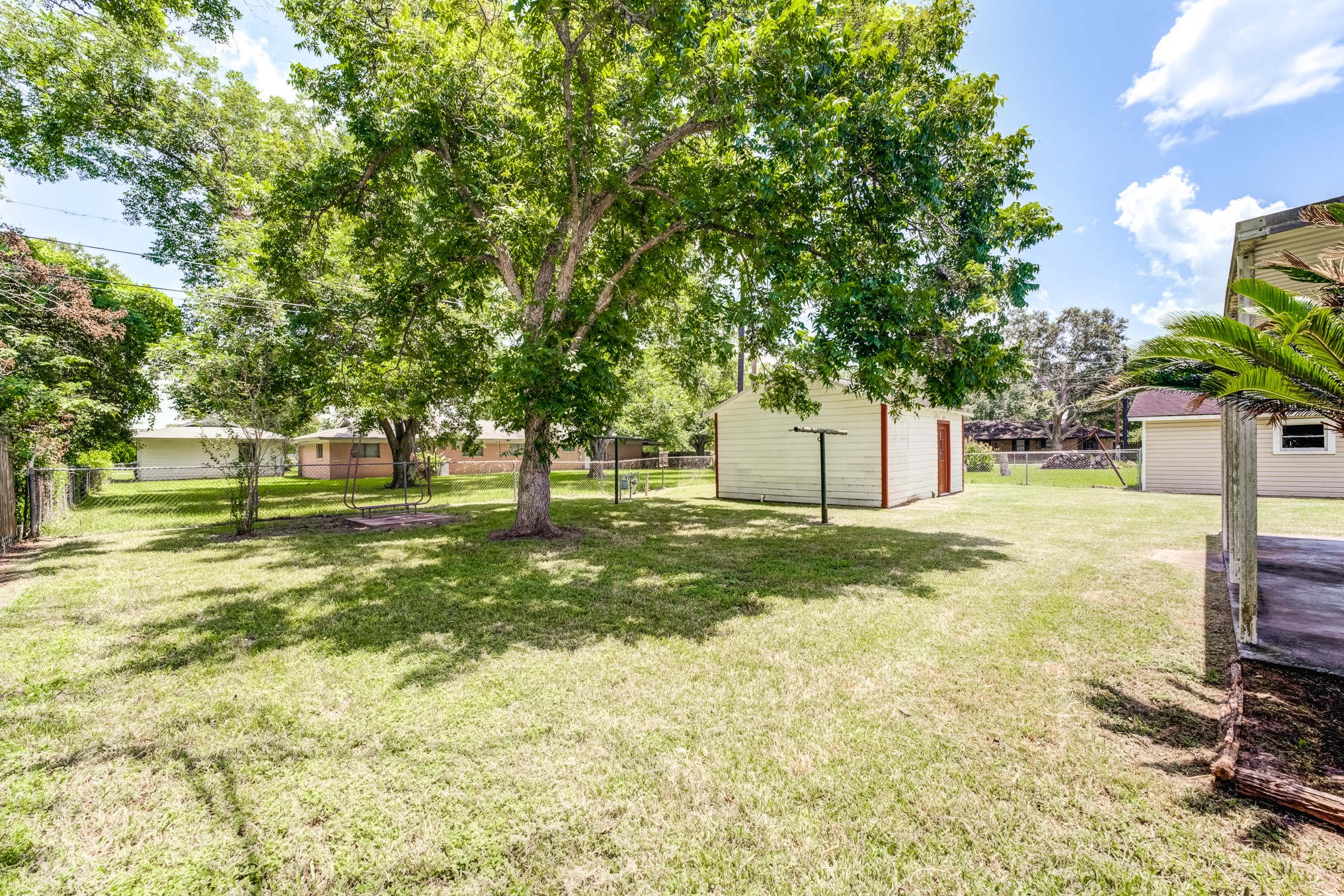 305 Yaupon Street Sweeny, TX 77480 - Photo 48 of 50 a view of a yard with a tree