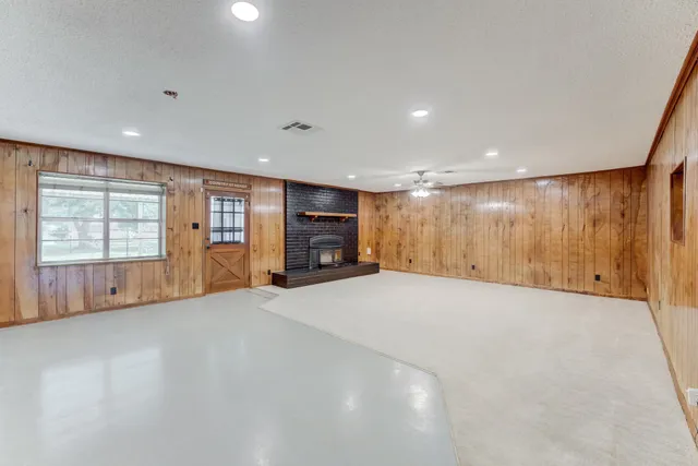 a big room with closet and windows
