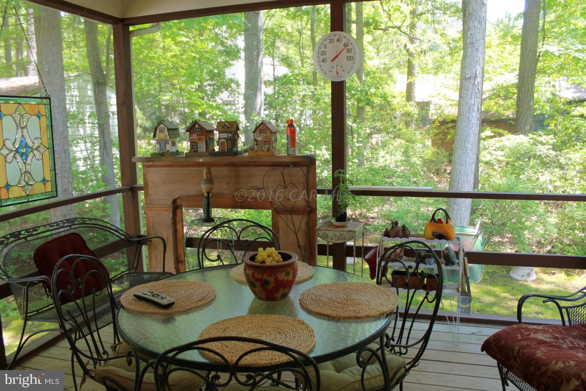 49 Moonraker Road Ocean Pines, MD 21811 - Photo 12 of 27 a view of a dining room with furniture window and outside view