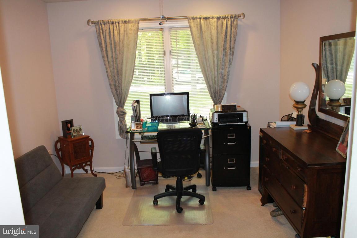 49 Moonraker Road Ocean Pines, MD 21811 - Photo 18 of 27 a view of a workspace with furniture and a window