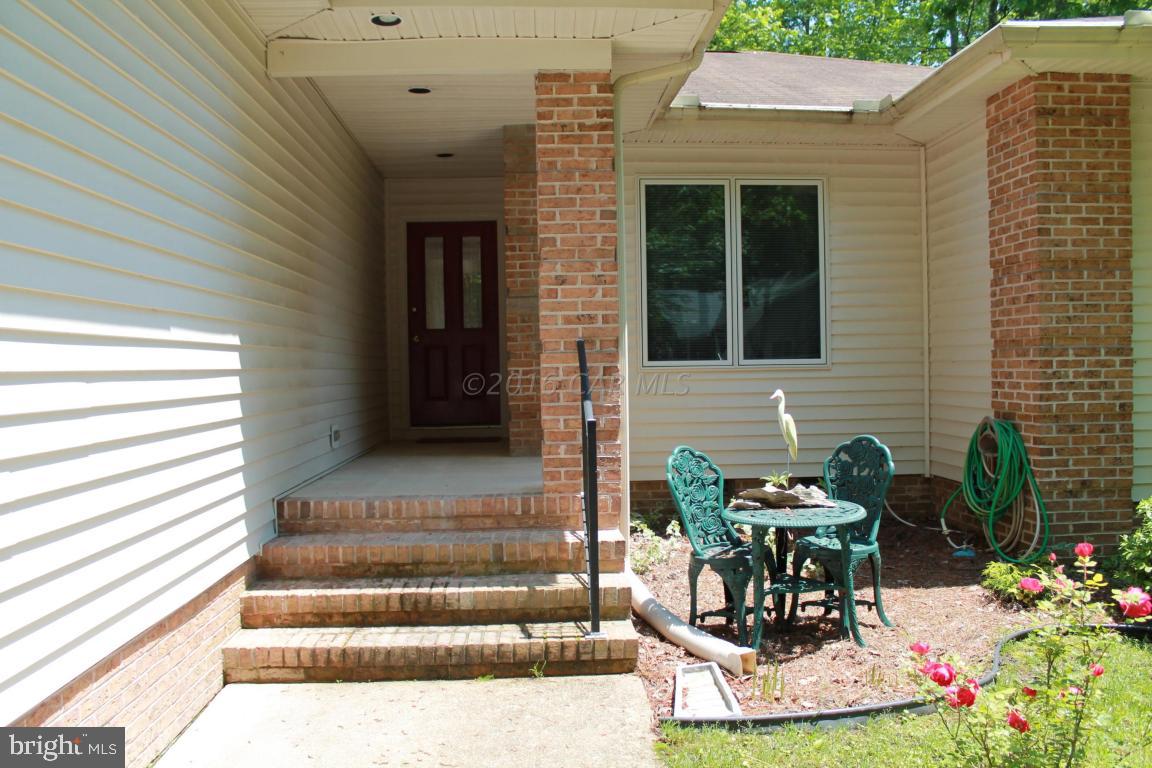 49 Moonraker Road Ocean Pines, MD 21811 - Photo 3 of 27 a view of house with outdoor seating