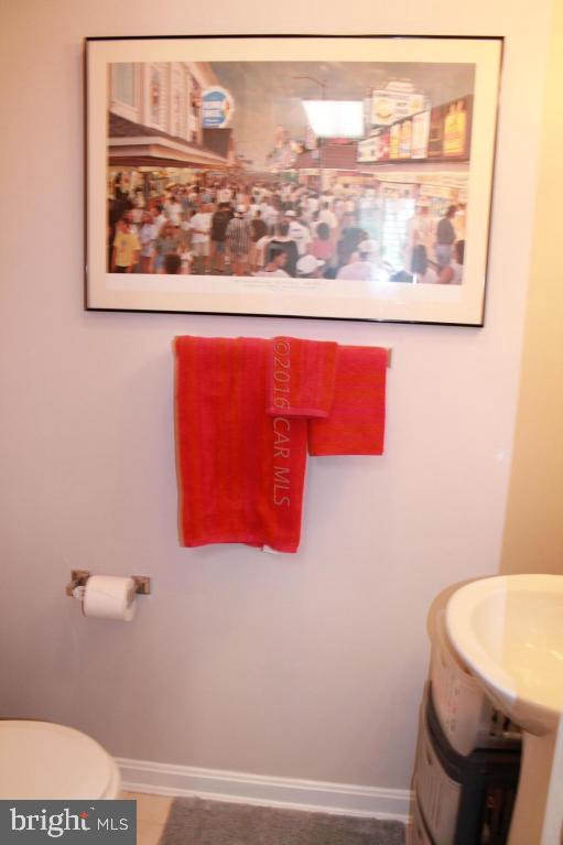 49 Moonraker Road Ocean Pines, MD 21811 - Photo 21 of 27 a bathroom with a toilet and a picture on the wall