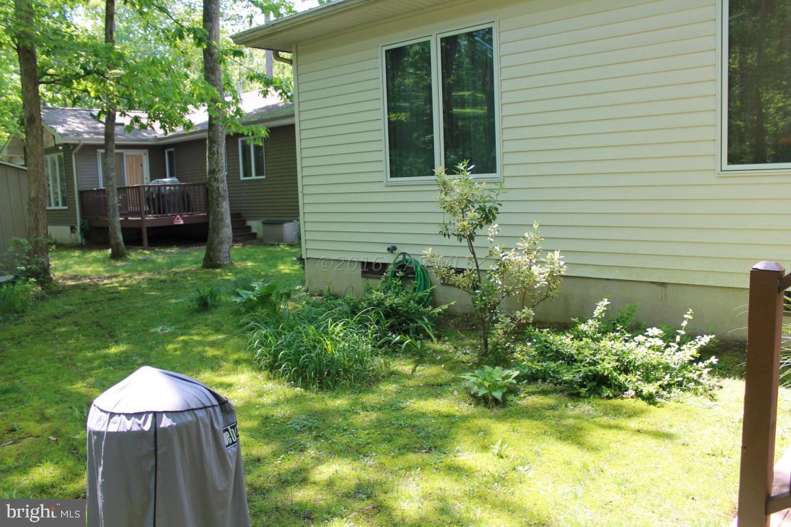 49 Moonraker Road Ocean Pines, MD 21811 - Photo 27 of 27 a front view of a house with a garden