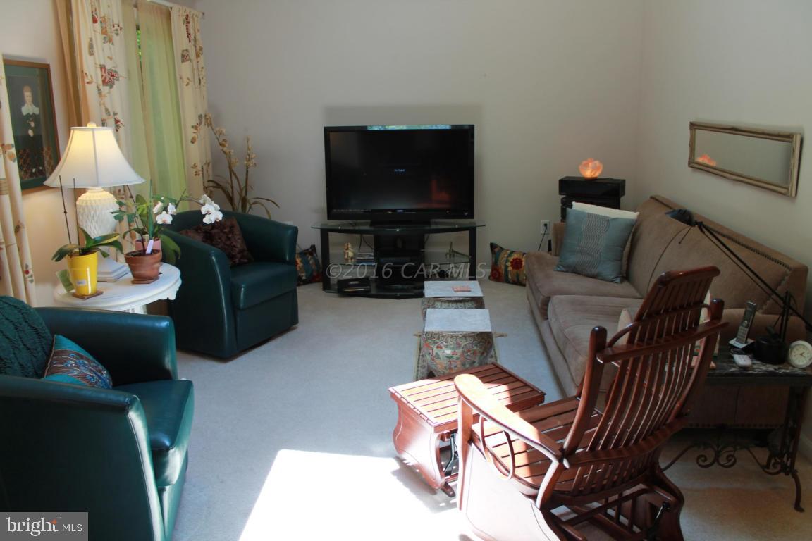 49 Moonraker Road Ocean Pines, MD 21811 - Photo 5 of 27 a living room with furniture and a flat screen tv