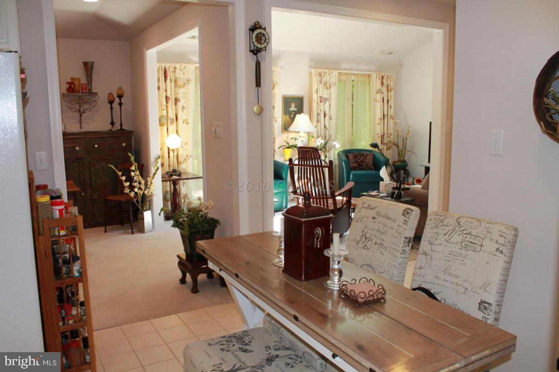 49 Moonraker Road Ocean Pines, MD 21811 - Photo 9 of 27 a room with gym equipment and a large mirror