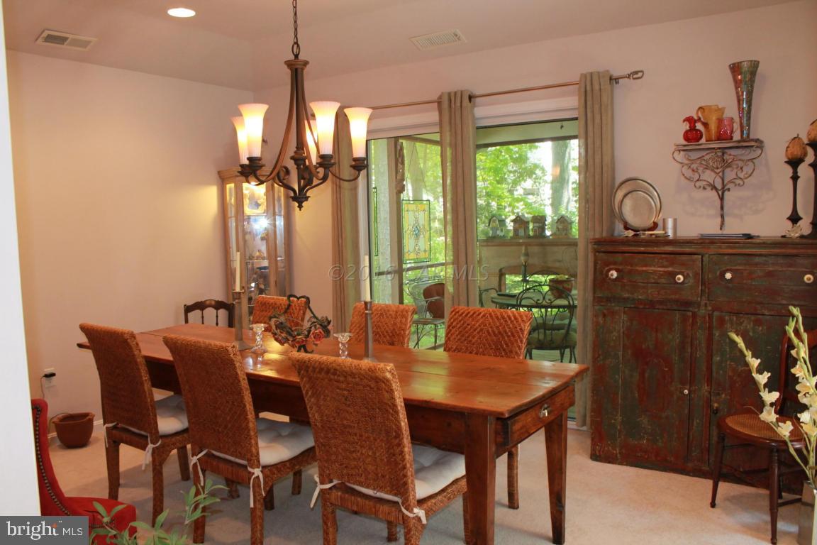 49 Moonraker Road Ocean Pines, MD 21811 - Photo 10 of 27 a dining room with furniture window and outside view