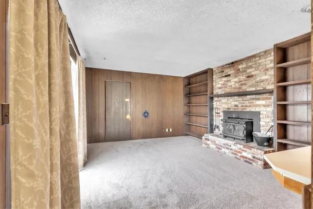 a view of a livingroom with a fireplace