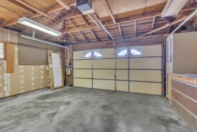 a view of an empty room with cabinet