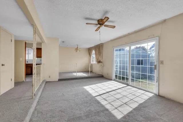 a view of empty room with windows