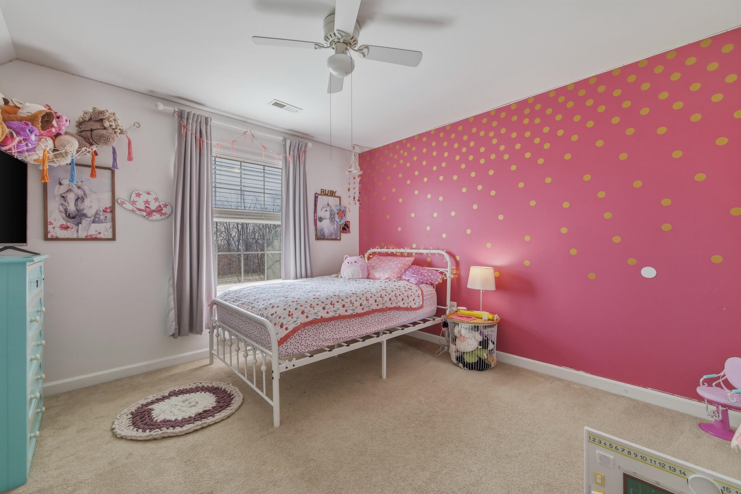 257 Hunter Road Maurertown, VA 22644 - Photo 33 of 61 a bedroom with a bed and a chandelier
