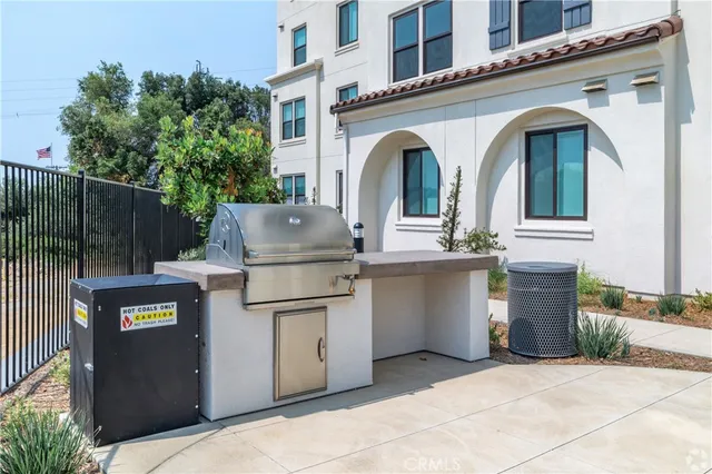 a view of a white house with many windows