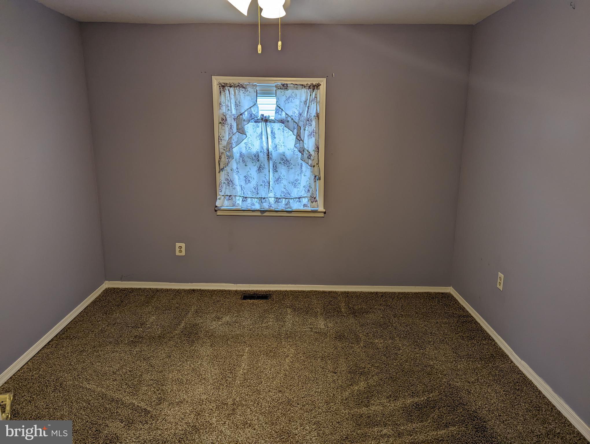 1510 Denton Road Essex, MD 21221 - Photo 12 of 39 an empty room with a window