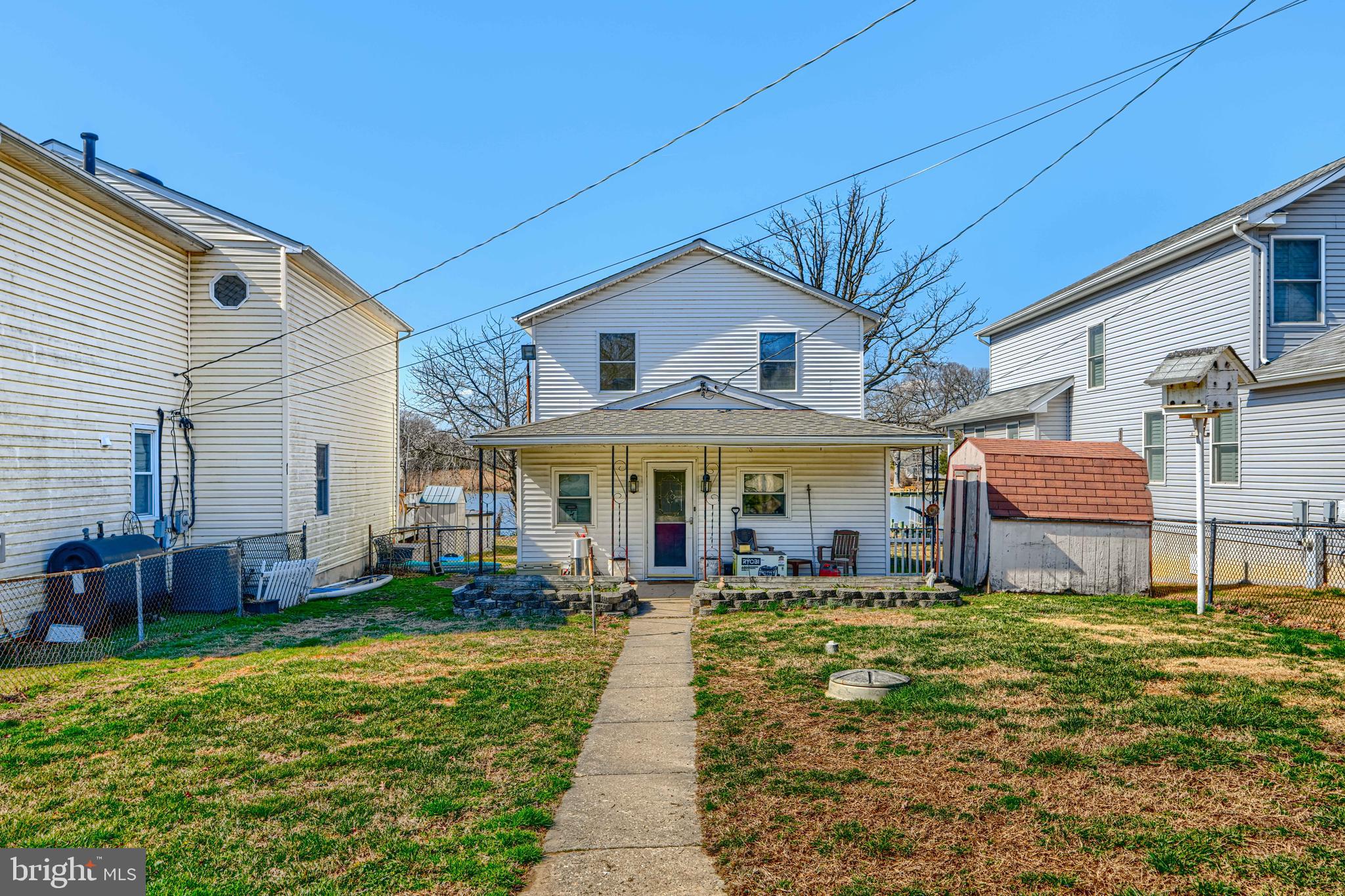 1510 Denton Road Essex, MD 21221 - Photo 13 of 39 a front view of a house with a yard table and chairs