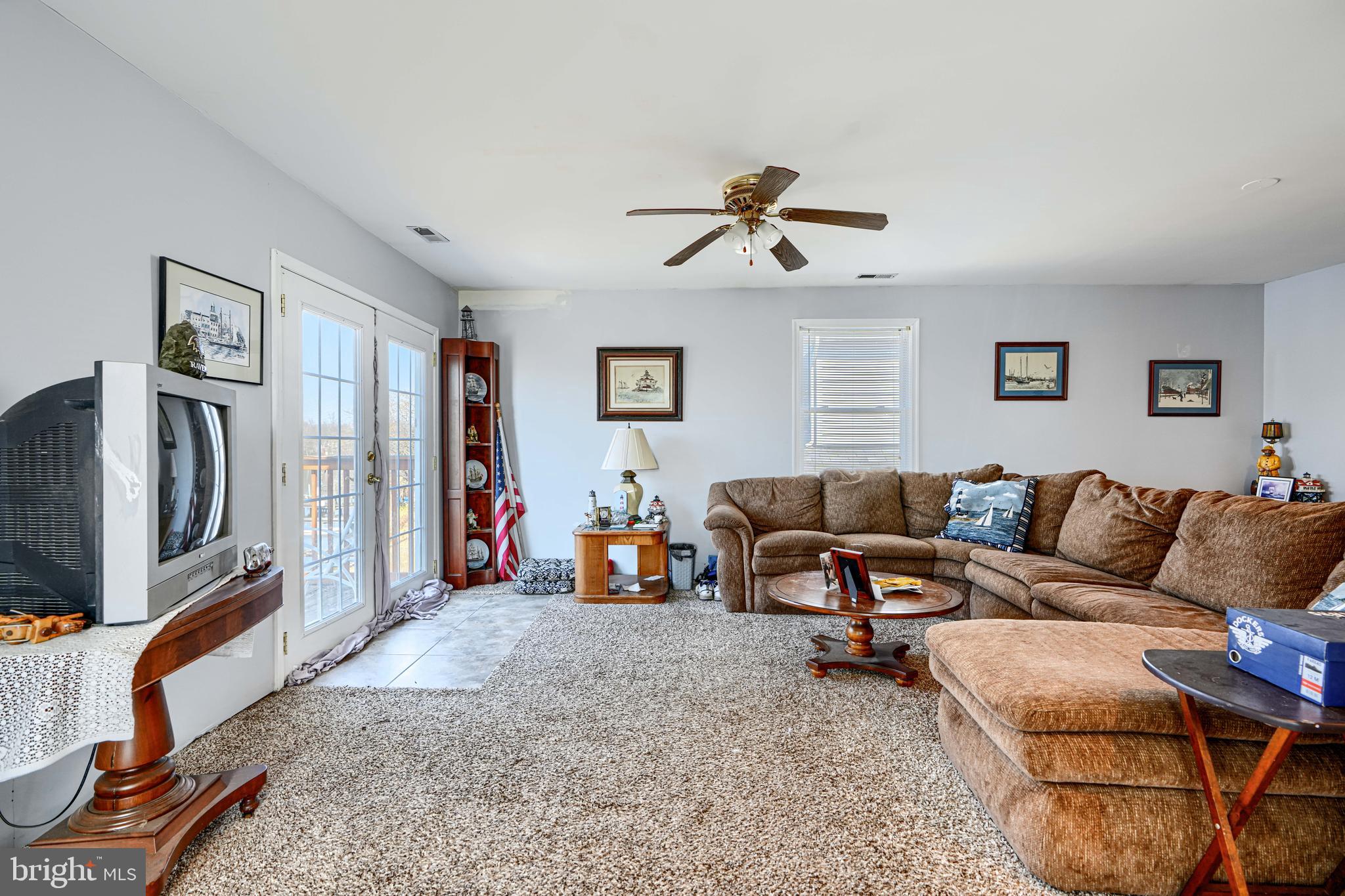 1510 Denton Road Essex, MD 21221 - Photo 17 of 39 a living room with furniture and a flat screen tv