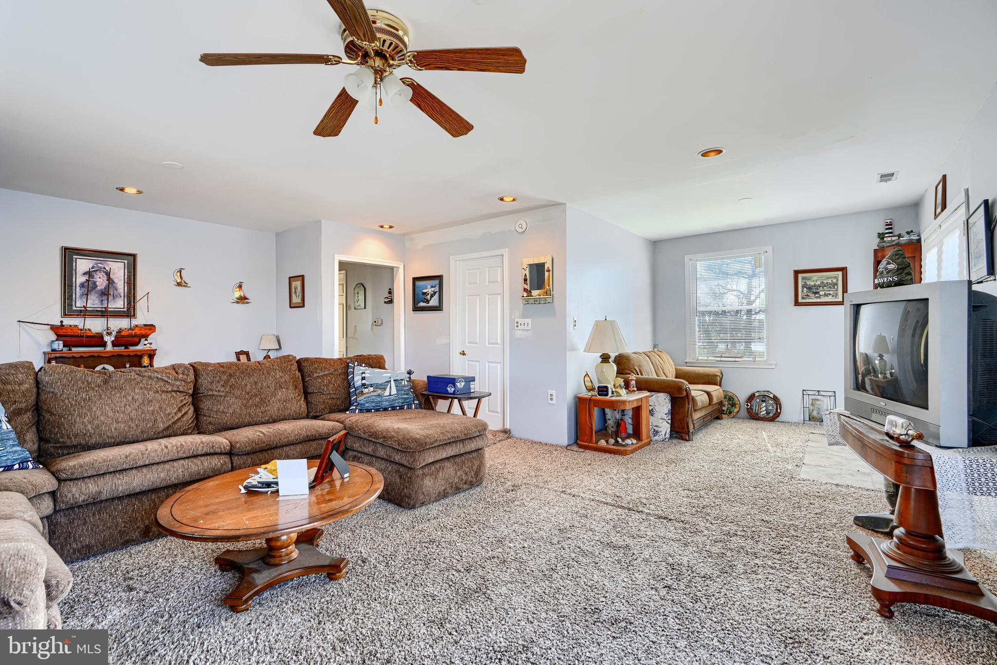 1510 Denton Road Essex, MD 21221 - Photo 18 of 39 a living room with furniture and a flat screen tv