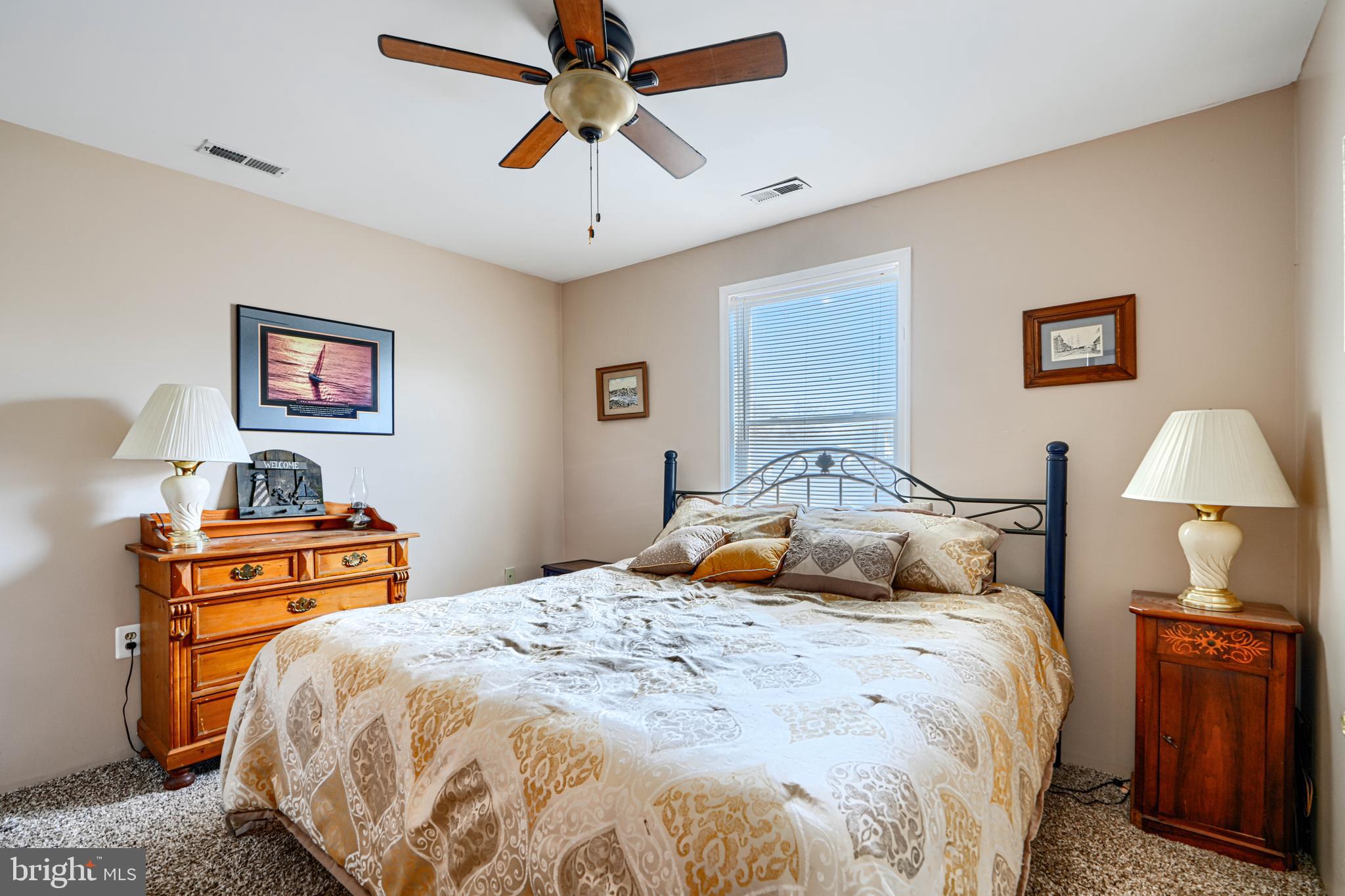 1510 Denton Road Essex, MD 21221 - Photo 20 of 39 a bedroom with a bed and wooden floor