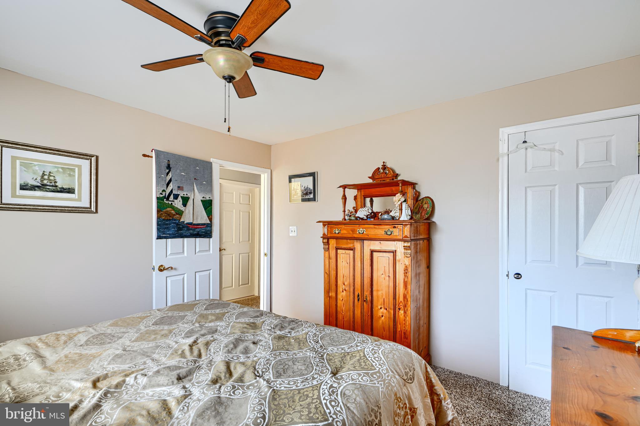 1510 Denton Road Essex, MD 21221 - Photo 21 of 39 a bedroom with a bed and a chandelier