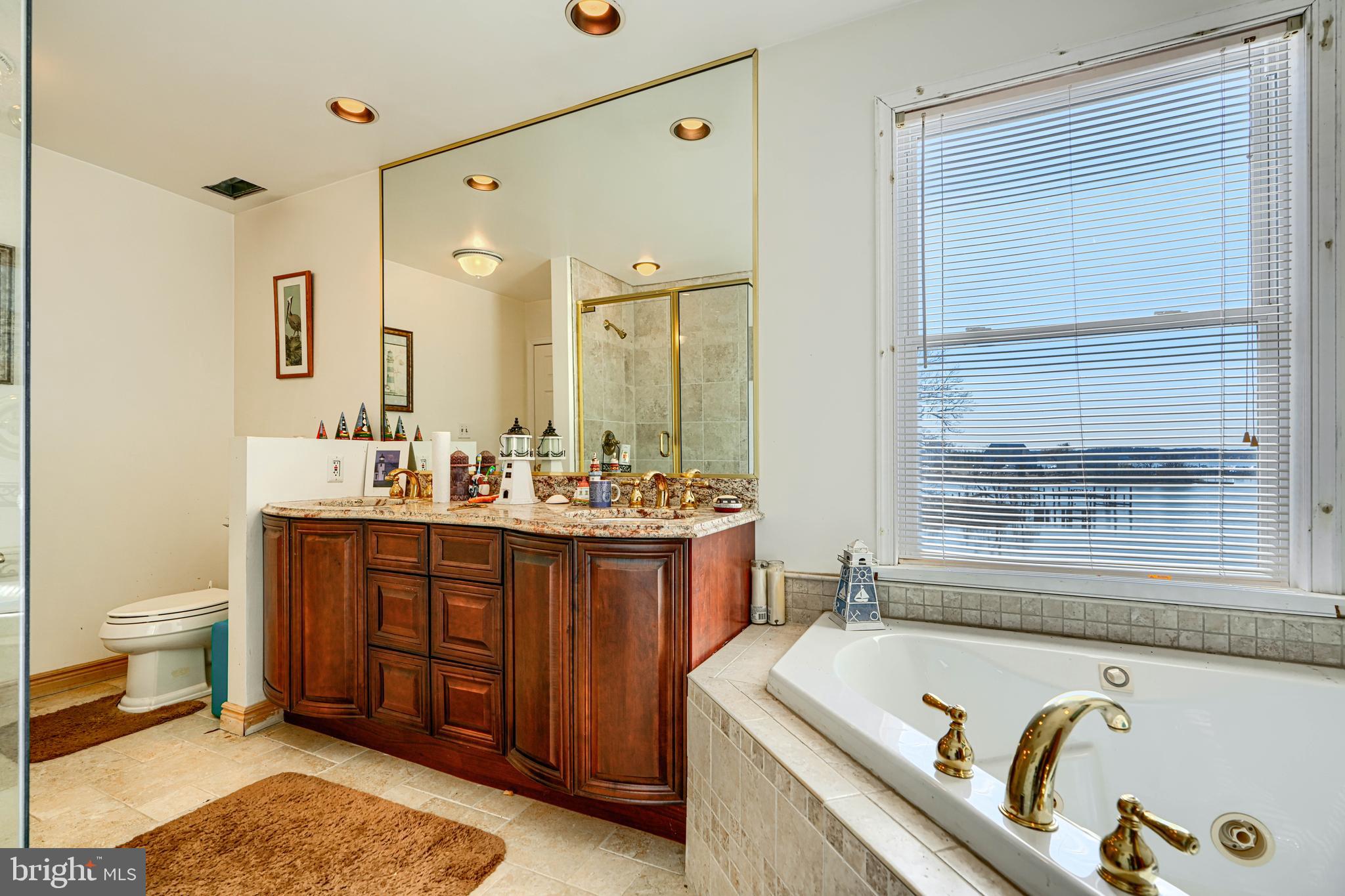 1510 Denton Road Essex, MD 21221 - Photo 24 of 39 a bathroom with a tub sink and mirror